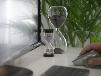 Two hourglasses on the desk.