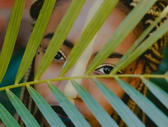 The girl hiding behind the leaves