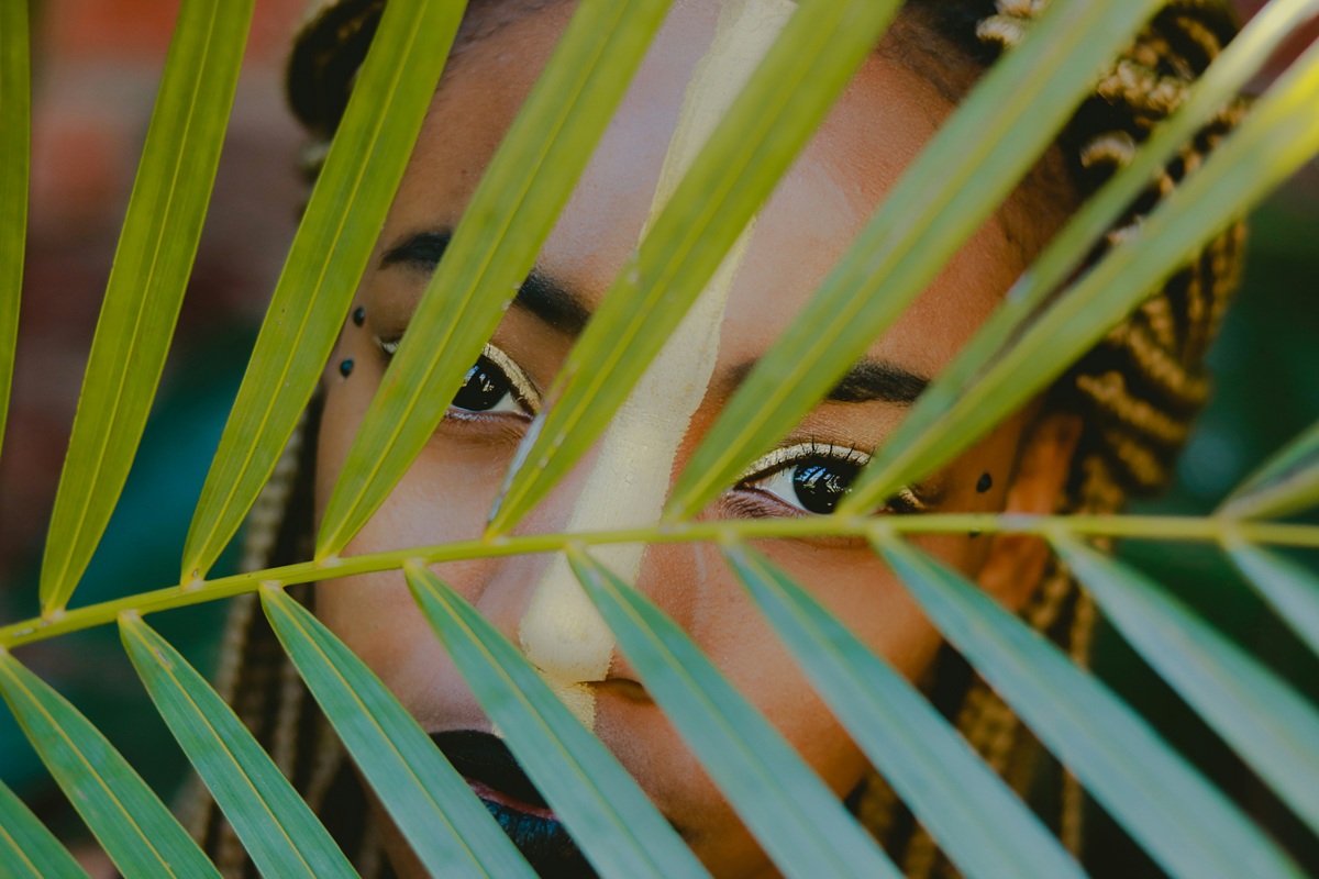 The girl hiding behind the leaves