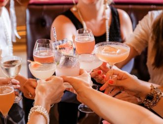 A photo of people making a toast.